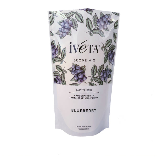 Front: iveta Blueberry Scone Mix. A bag of dry ingredients for making delicious, juicy blueberry scones. Dried blueberries are visible in the mix. "Easy to Bake" and "Handcrafted in Santa Cruz, California" are also on the bag.