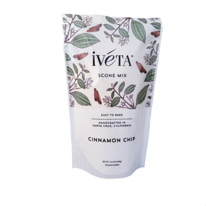 Front: iveta Cinnamon Chip Scone Mix. A bag of dry ingredients for making warm and comforting cinnamon chip scones. Cinnamon chips are visible throughout the mix. "Easy to Bake" and "Handcrafted in Santa Cruz, California" are also on the bag.
