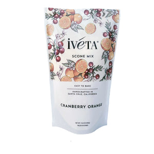Front: iveta Cranberry Orange Scone Mix. A bag of dry ingredients for making bright and citrusy cranberry orange scones. Dried cranberries and orange zest are visible in the mix. "Easy to Bake" and "Handcrafted in Santa Cruz, California" are also on the bag.
