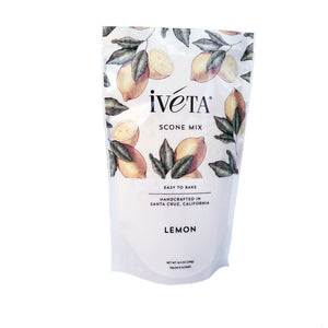 Front: iveta Lemon Scone Mix. A bag of dry ingredients for making bright and zesty lemon scones. Lemon zest may be visible in the mix. "Easy to Bake" and "Handcrafted in Santa Cruz, California" are also on the bag.
