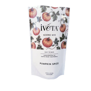 iveta Pumpkin Spice Scone Mix. A bag of dry ingredients for making warm and spiced pumpkin scones. The mix likely has a warm orange color and visible spices. "Easy to Bake" and "Handcrafted in Santa Cruz, California" are also on the bag.