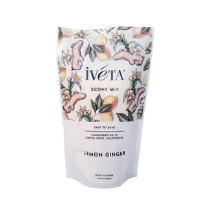  iveta Lemon Ginger Scone Mix. A bag of dry ingredients for making spicy and citrusy lemon ginger scones. Crystallized ginger pieces and lemon zest are visible. "Easy to Bake" and "Handcrafted in Santa Cruz, California" are also on the bag.